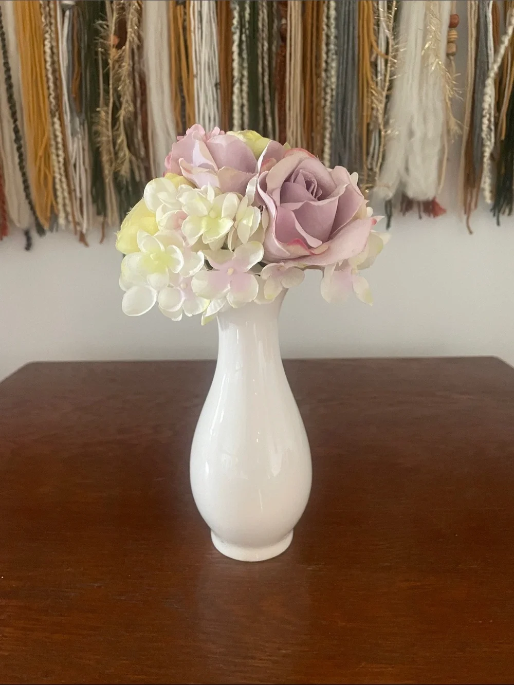 White 6 inch vase with light color flowers